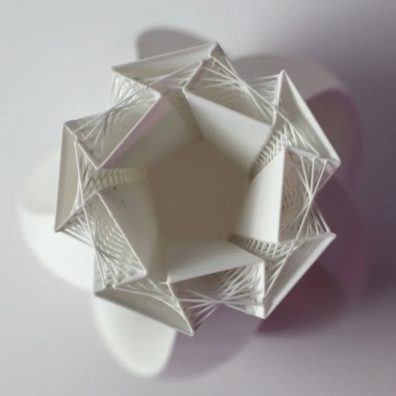 Twisted vase with strands