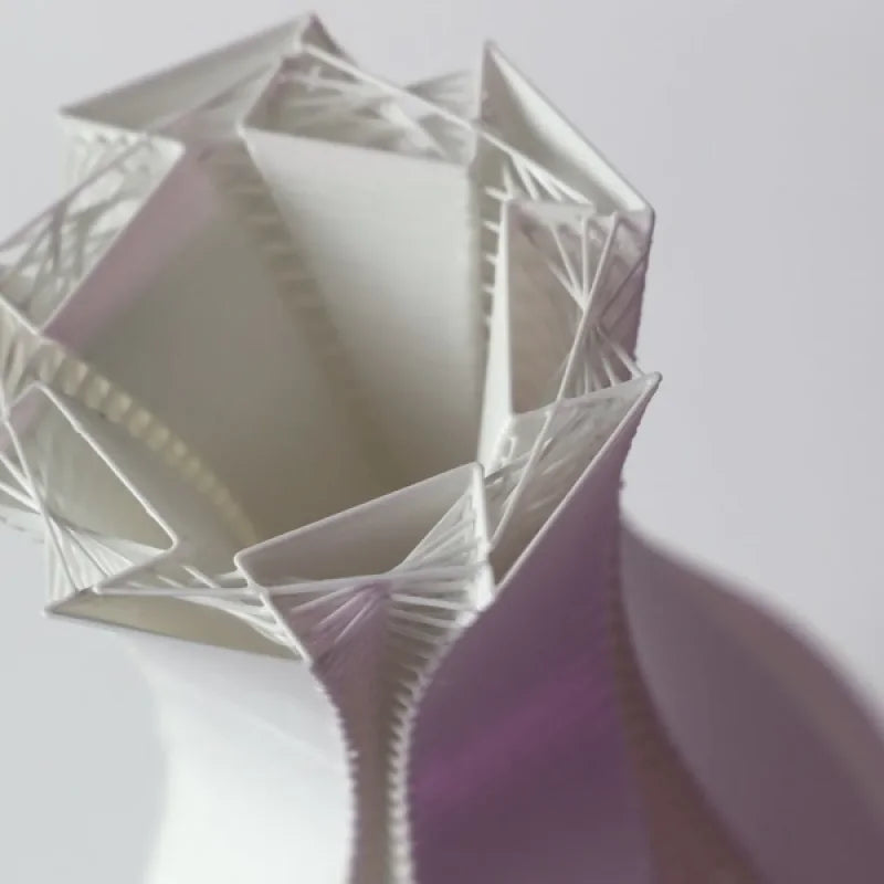 Twisted vase with strands